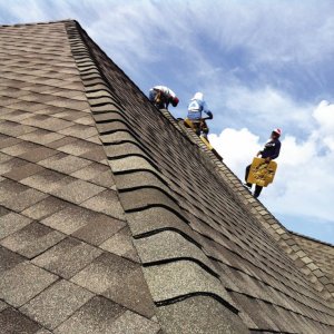 Installing A New Roof Angie S List Workers Install Asphalt Shingles On Roof