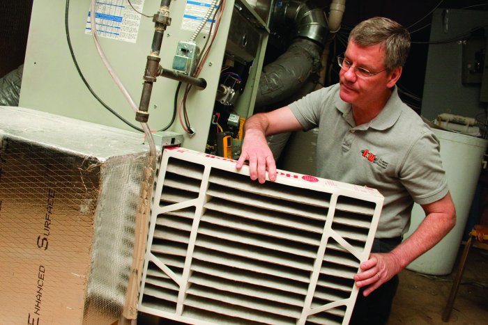 furnace technician installs filter furnace technician installs filter