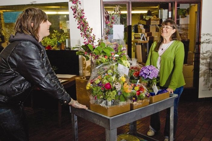 Pat Hutchins (right) of Flowers in Flight in Portland, Ore., readies her store's one-of-a-kind bouquets for delivery. (Photo by James Holk)