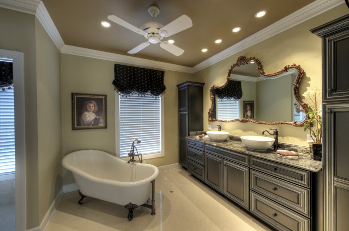 bathroom with vessel sinks and vintage mirror