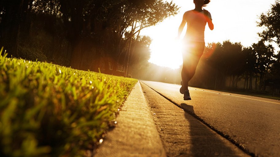 Person running along road