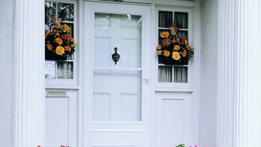 white Pella storm door on home exterior
