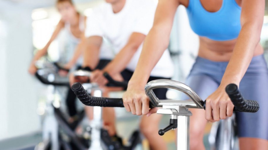 Women riding a stationary bicycle