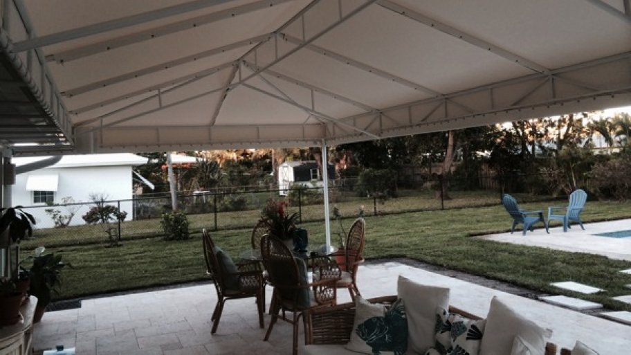 large awning covers patio with outdoor living room furniture